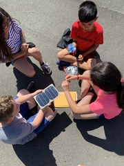 Students working with solar panels